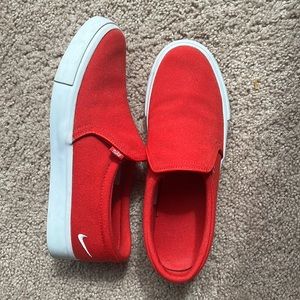 Red Nike slip ons